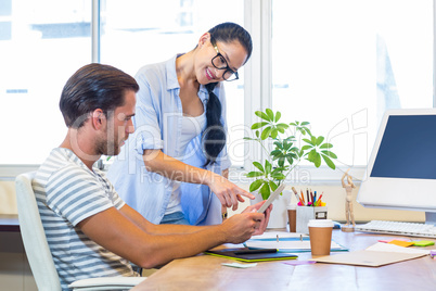 Smiling partners working together on files