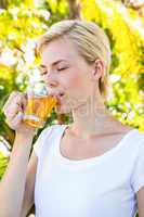 Attractive blonde woman drinking tea