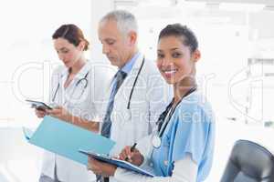 Doctors working together on patients file