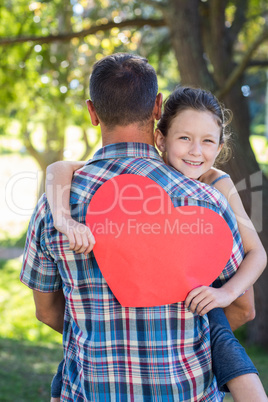 Father and daughter hugging in the park