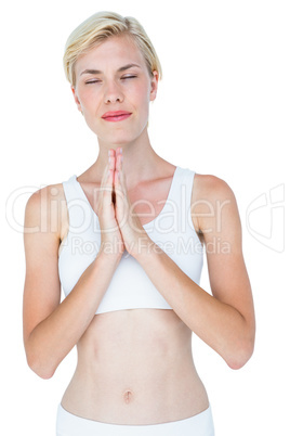 Fit woman meditating eyes closed