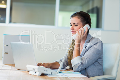 Pretty businesswoman having phone call