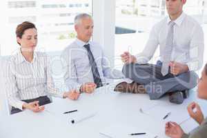 Business team relaxing eyes closed