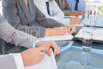 Business team taking notes during conference