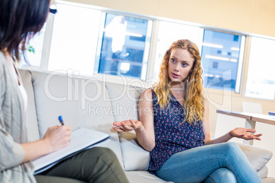 Psychologist talking with her patient