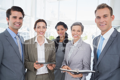 Business people with tablet and notebook