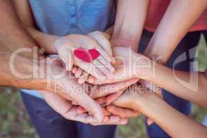 Friends holding a heart