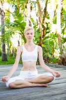 Pretty fit blonde woman meditating