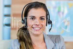 Pretty travel agent smiling at camera