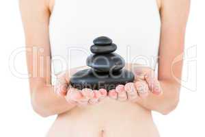 Fit woman holding stones