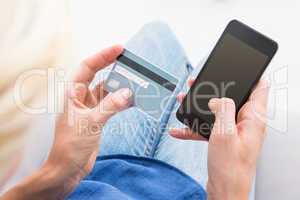 Woman doing online shopping with her mobile phone