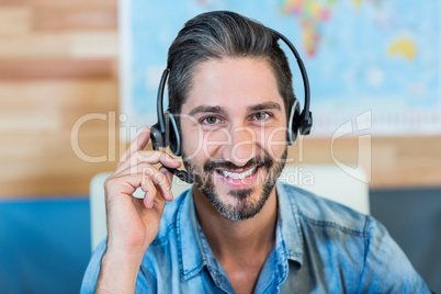 Smiling travel agent looking at camera