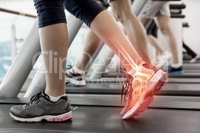 Highlighted ankle of woman on treadmill