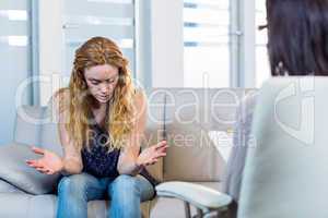 Psychologist talking with her depressed patient