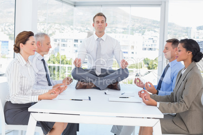 Business team relaxing eyes closed