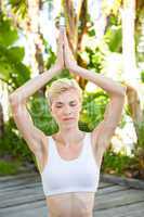 Pretty fit blonde woman meditating