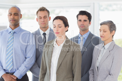 Business team relaxing eyes closed