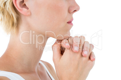 Pretty blonde woman praying
