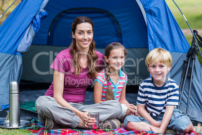 mother and children having fun in the park