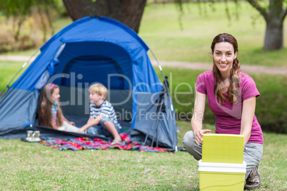 mother and children having fun in the park