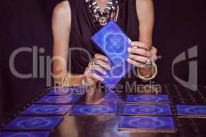 Fortune teller forecasting the future with tarot cards