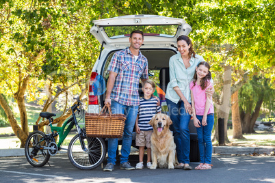 Happy family getting ready for road trip