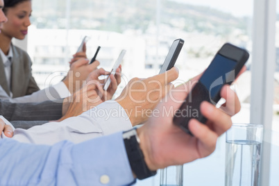 Business team using their mobile phone