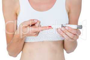 Woman doing test with blood glucose monitor