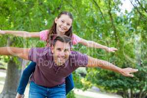 Father and daughter having fun in the park