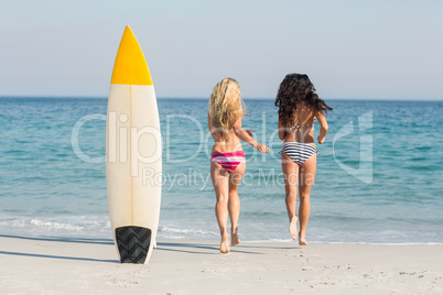 two friends in swimsuits