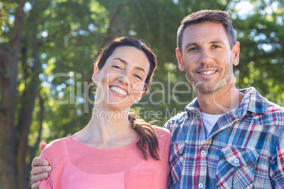 Happy couple smilling in park