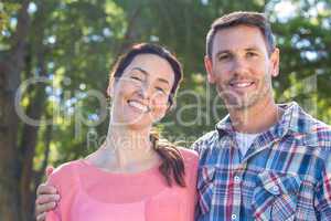 Happy couple smilling in park