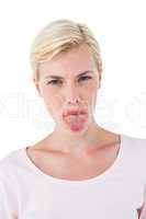 Blonde woman sticking her tongue out