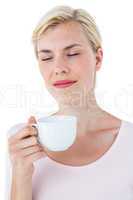 Attractive blonde woman holding mug