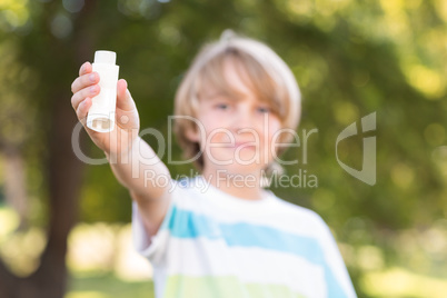 Little boy using his inhaler