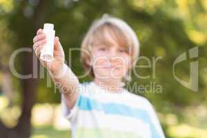 Little boy using his inhaler