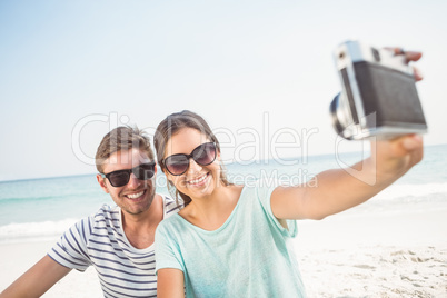 happy couple taking selfie