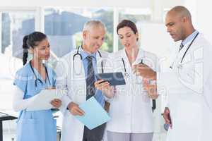 Team of doctors working together on patients file