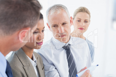 Businessman drawing graph on the board