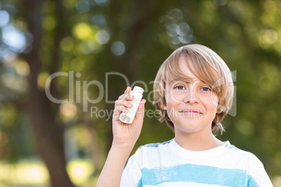 Little boy using his inhaler