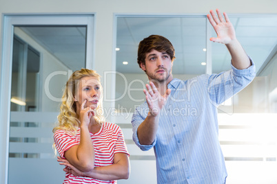 Handsome businessman doing frame with his hands and showing to h