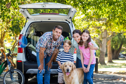 Happy family getting ready for road trip