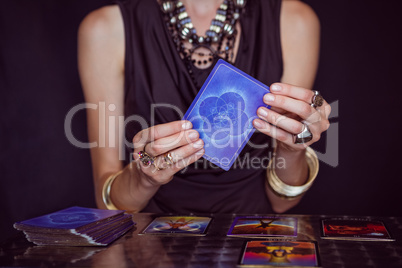 Fortune teller forecasting the future with tarot cards