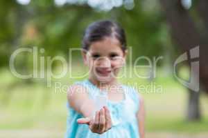 Little girl showing his inhaler