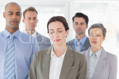 Business team relaxing eyes closed