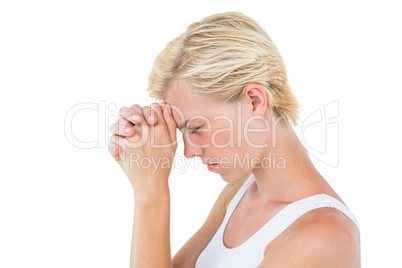 Pretty blonde woman praying