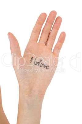 Hand showing the words I believe