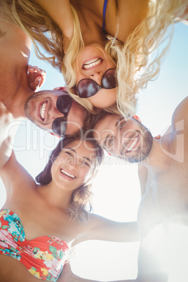 group of friends in swimsuits taking a selfie