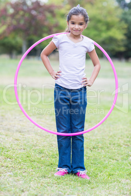 happy girl playing with hula hoops