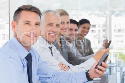 Business team using their mobile phone